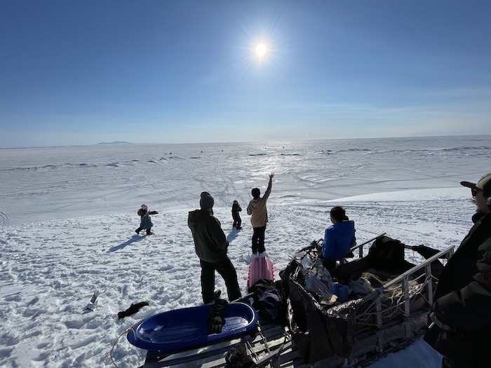 Sikuaq&#39;s family gathered on the beach. Image courtesy of Kaare Sikuaq Erickson.