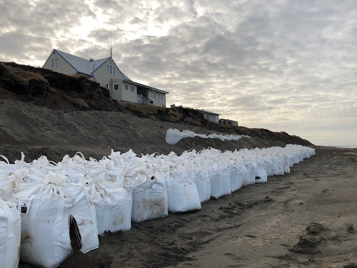 Figure 4. Photo from Utqiagvik showing erosion mitigation measures being utilized to mitigate impacts of erosion to permafrost coastal bluffs and houses that sit atop the bluffs. Photo courtesy of Anne Jensen.