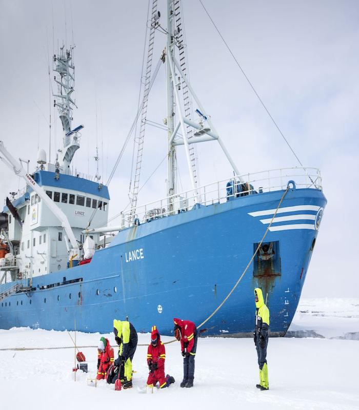  IASC facilitates international and interdisciplinary connections for Arctic science. Students pictured above are  moored to an ice-flow next to the Norwegian Polar Institute&#39;s RV Lance. Photo courtesy of Lawrence Hislop, Norwegian Polar Institute.