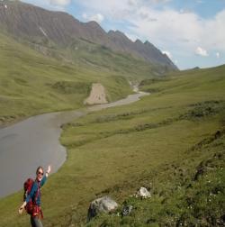 Hannah Manninen hikes along the Atigun River on the way to Atigun Falls on a day off from field work. Near Toolik Field Station, Alaska.