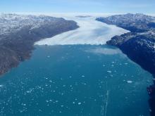 A massive marine terminating glacier. Aboard the P-3 Orion, flying over Greenland. Photo by Mark Buesing (PolarTREC 2013)